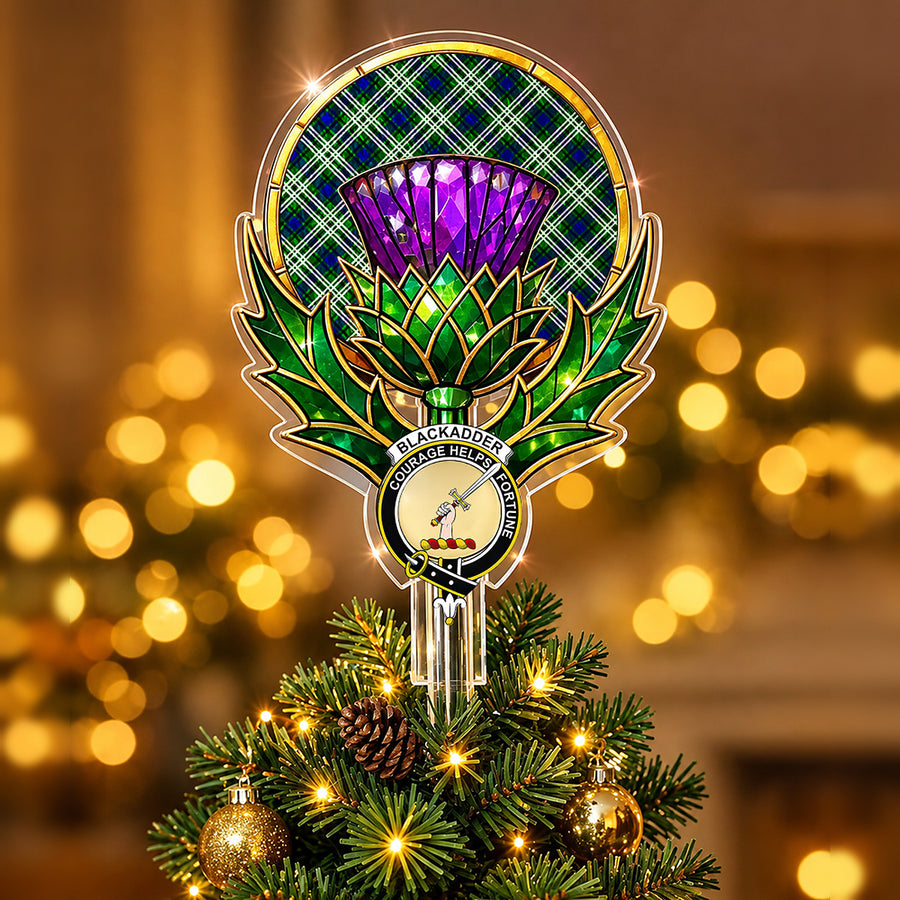 Clan Blackadder crest in the centre of a stained-glass style thistle Christmas tree topper with the Blackadder tartan behind the thistle