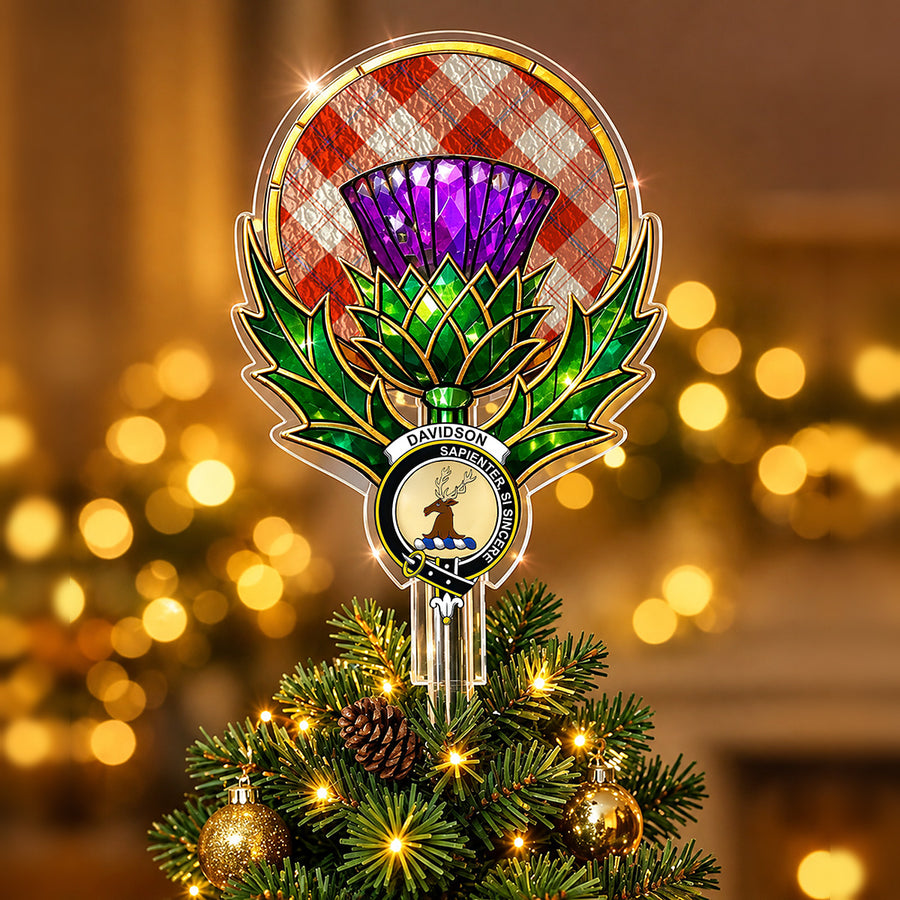 Clan Davidson crest in the centre of a stained-glass style thistle Christmas tree topper with the Davidson Dress Dancers tartan behind the thistle