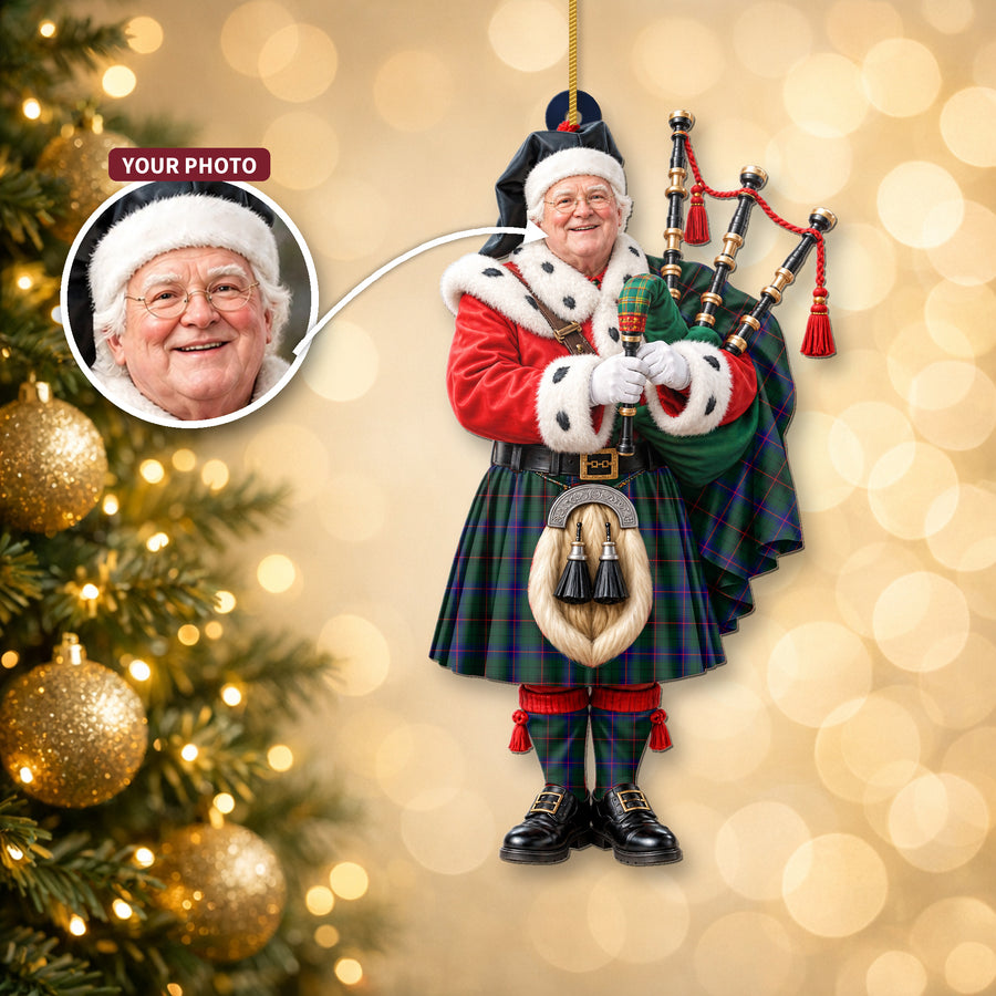 Christmas piper ornament in the Davidson Modern tartan hanging on a Christmas tree, with the customer photo used for the face