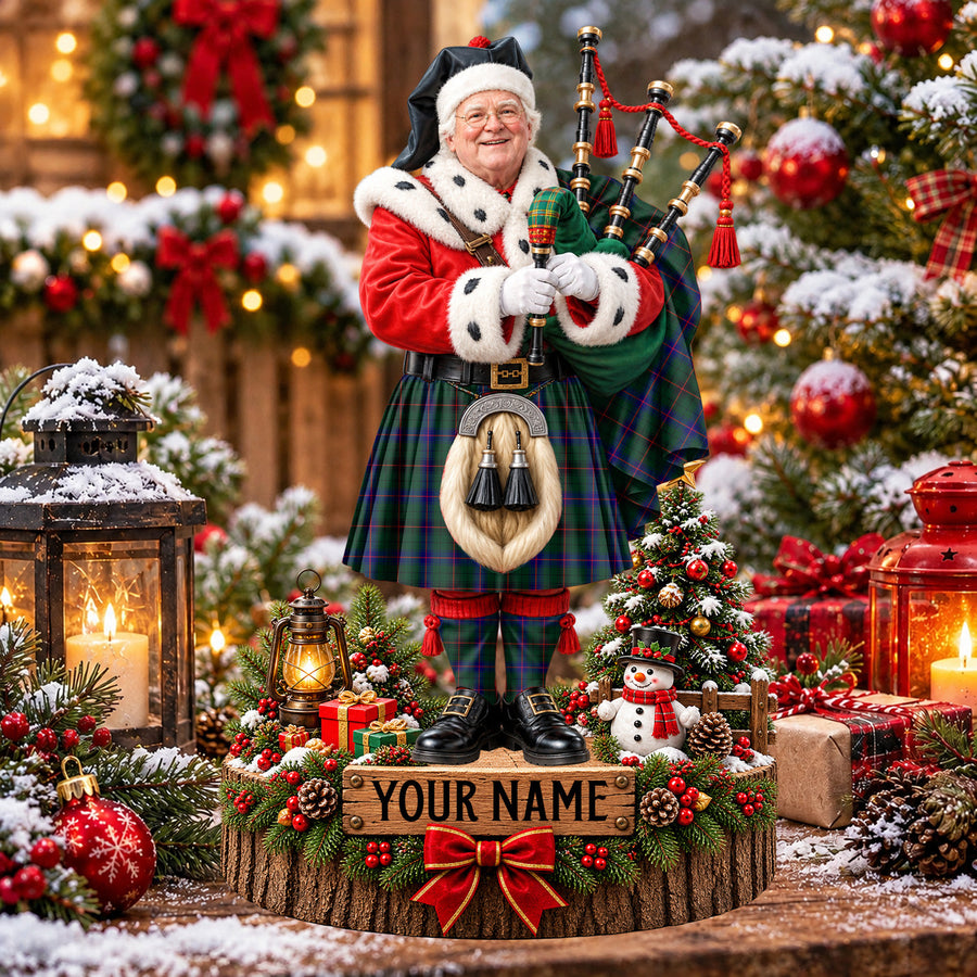 Personalized Christmas piper plaque in the Davidson Modern tartan, standing on a snowy log base with a name plaque