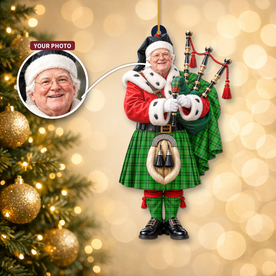 Christmas piper ornament in the Galloway District tartan hanging on a Christmas tree, with the customer photo used for the face