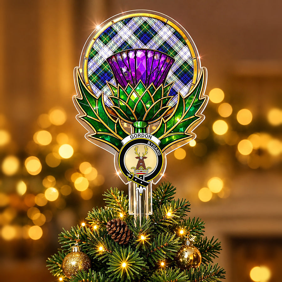Clan Gordon crest in the centre of a stained-glass style thistle Christmas tree topper with the Gordon Dress Modern tartan behind the thistle