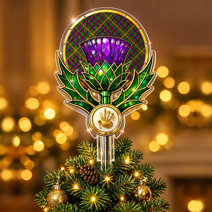 Stained-glass style thistle Christmas tree topper with a gold bagpipe emblem and the Hall tartan behind the thistle