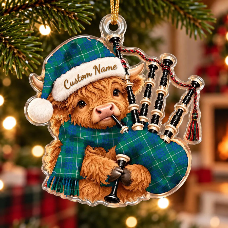 Acrylic Highland cow calf ornament playing the bagpipes, in a Hamilton Hunting Ancient tartan Santa hat, scarf and pipe bag, with a custom name on the hat