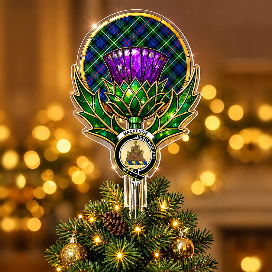 Clan MacKenzie crest in the centre of a stained-glass style thistle Christmas tree topper with the MacKenzie Modern tartan behind the thistle