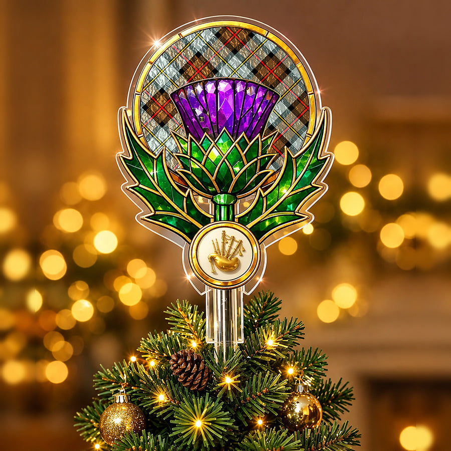 Stained-glass style thistle Christmas tree topper with a gold bagpipe emblem and the MacLeod of Harris Weathered tartan behind the thistle