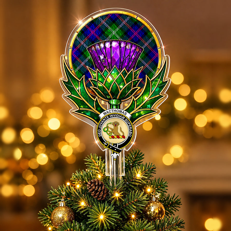 Clan MacThomas crest in the centre of a stained-glass style thistle Christmas tree topper with the MacThomas Modern tartan behind the thistle