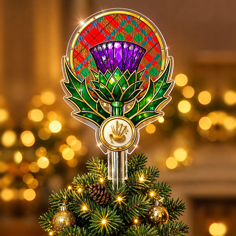 Stained-glass style thistle Christmas tree topper with a gold bagpipe emblem and the McIlvian tartan behind the thistle