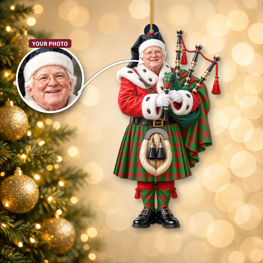 Christmas piper ornament in the Middleton Modern tartan hanging on a Christmas tree, with the customer photo used for the face