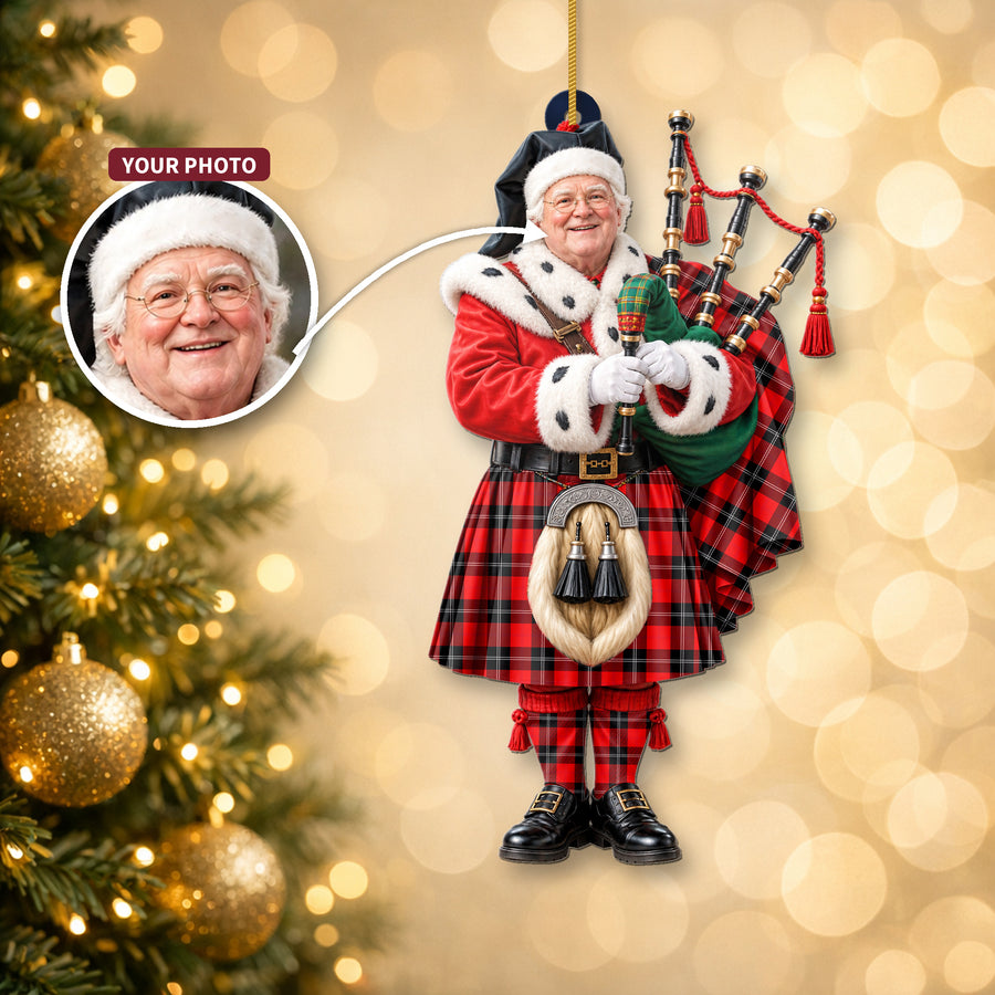Christmas piper ornament in the Ramsay Modern tartan hanging on a Christmas tree, with the customer photo used for the face