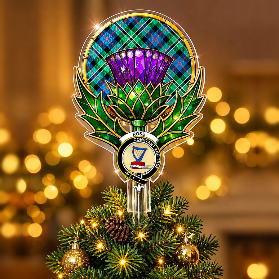 Clan Rose crest in the centre of a stained-glass style thistle Christmas tree topper with the Rose Hunting Ancient tartan behind the thistle