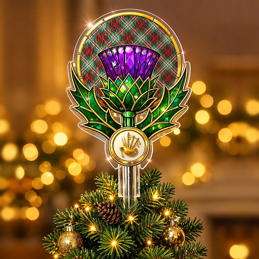 Stained-glass style thistle Christmas tree topper with a gold bagpipe emblem and the Scott Brown Ancient tartan behind the thistle