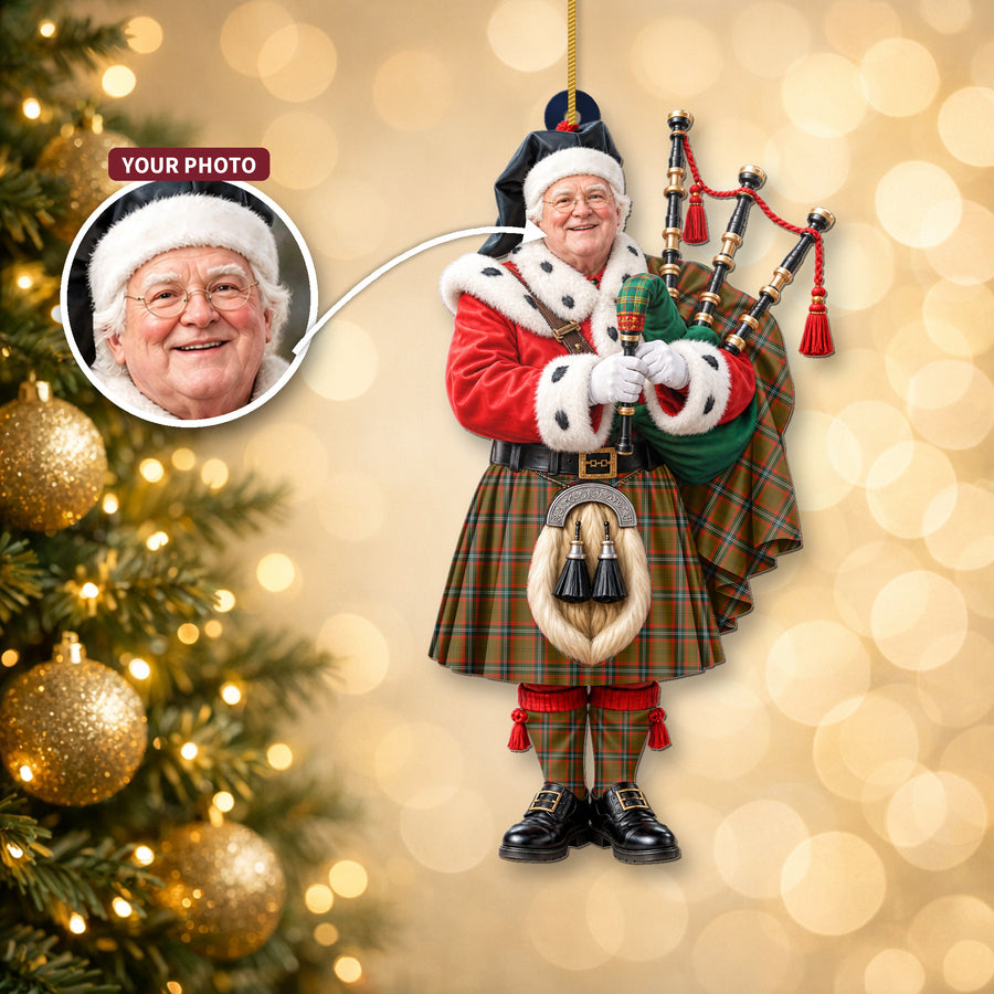 Christmas piper ornament in the Seton Hunting Modern tartan hanging on a Christmas tree, with the customer photo used for the face