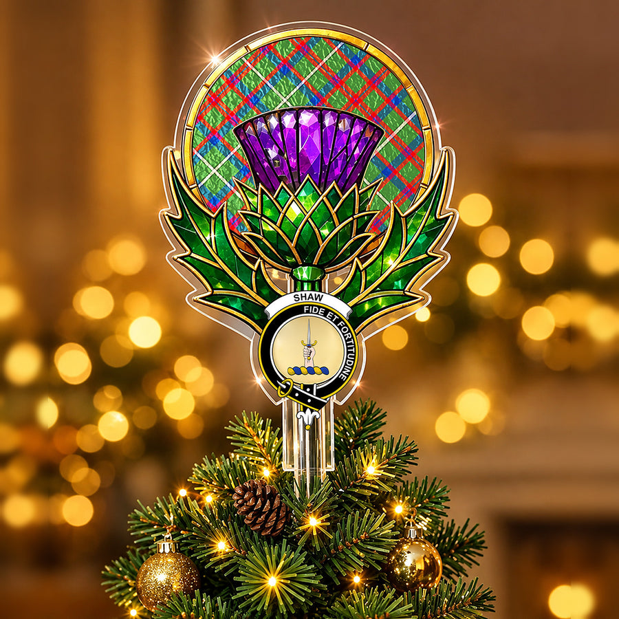 Clan Shaw crest in the centre of a stained-glass style thistle Christmas tree topper with the Shaw Green Modern tartan behind the thistle