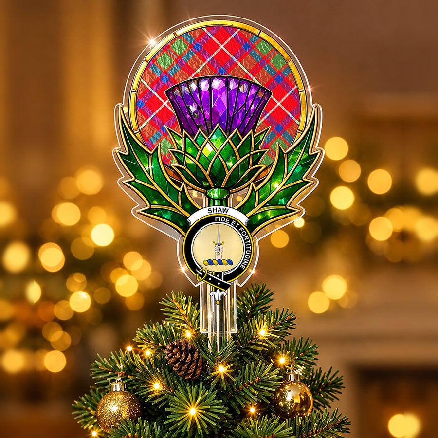 Clan Shaw crest in the centre of a stained-glass style thistle Christmas tree topper with the Shaw Red Modern tartan behind the thistle