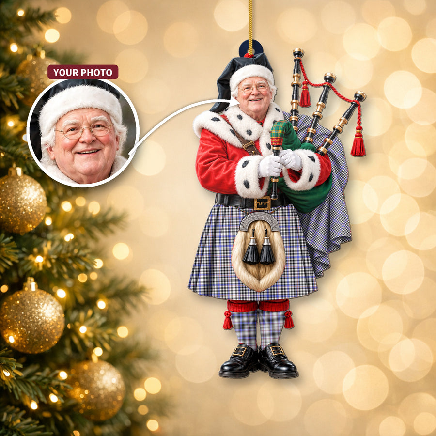 Christmas piper ornament in the Sir Walter Scott tartan hanging on a Christmas tree, with the customer photo used for the face
