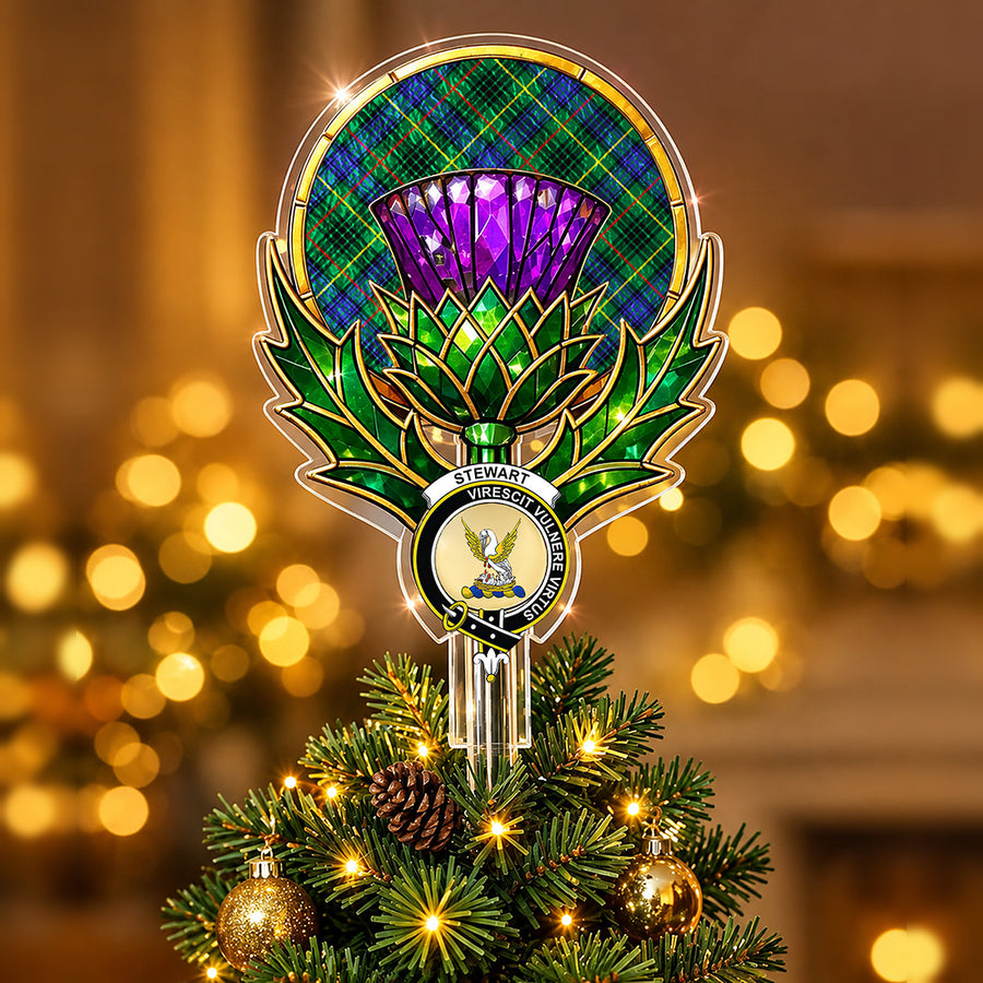 Clan Stewart crest in the centre of a stained-glass style thistle Christmas tree topper with the Stewart Hunting Modern tartan behind the thistle