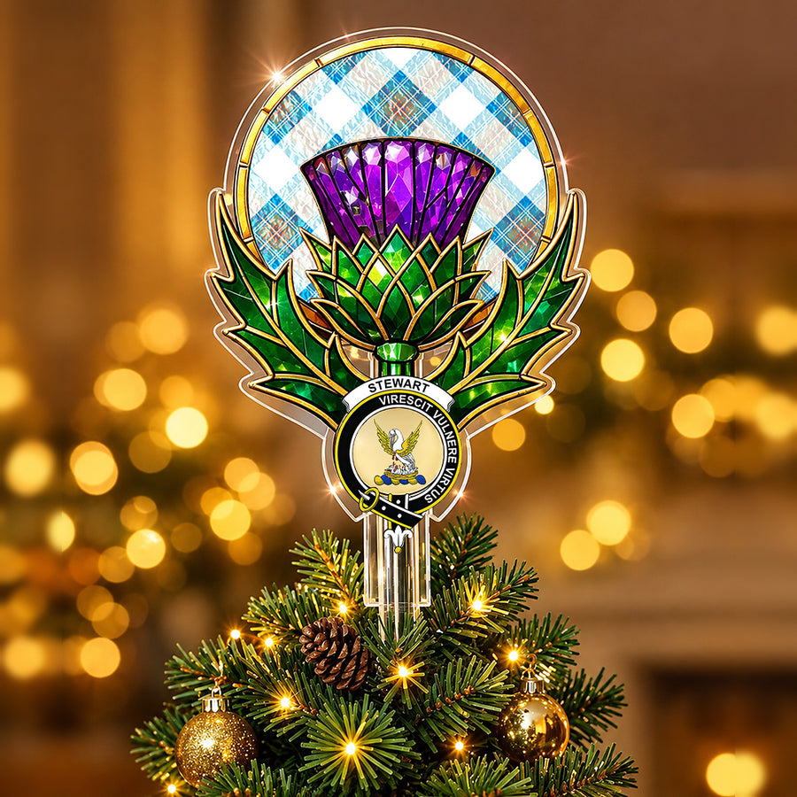 Clan Stewart crest in the centre of a stained-glass style thistle Christmas tree topper with the Stewart Muted Blue tartan behind the thistle