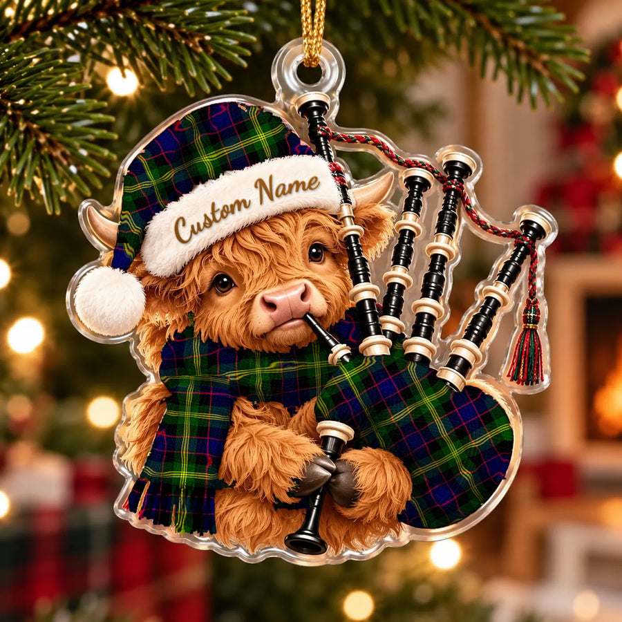 Acrylic Highland cow calf ornament playing the bagpipes, in a Watson Modern tartan Santa hat, scarf and pipe bag, with a custom name on the hat
