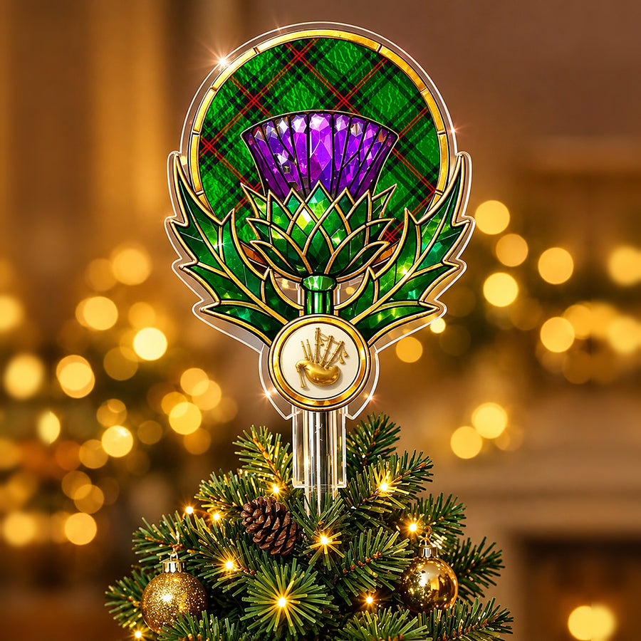 Stained-glass style thistle Christmas tree topper with a gold bagpipe emblem and the Fife District tartan behind the thistle
