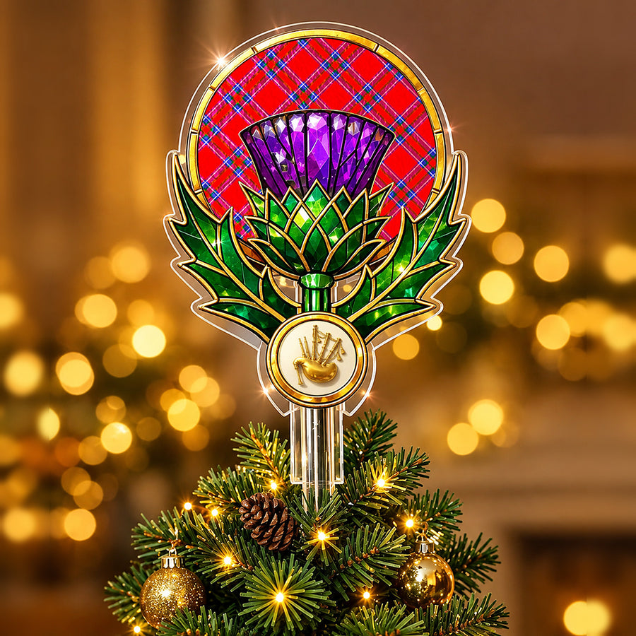 Stained-glass style thistle Christmas tree topper with a gold bagpipe emblem and the Inverness District tartan behind the thistle