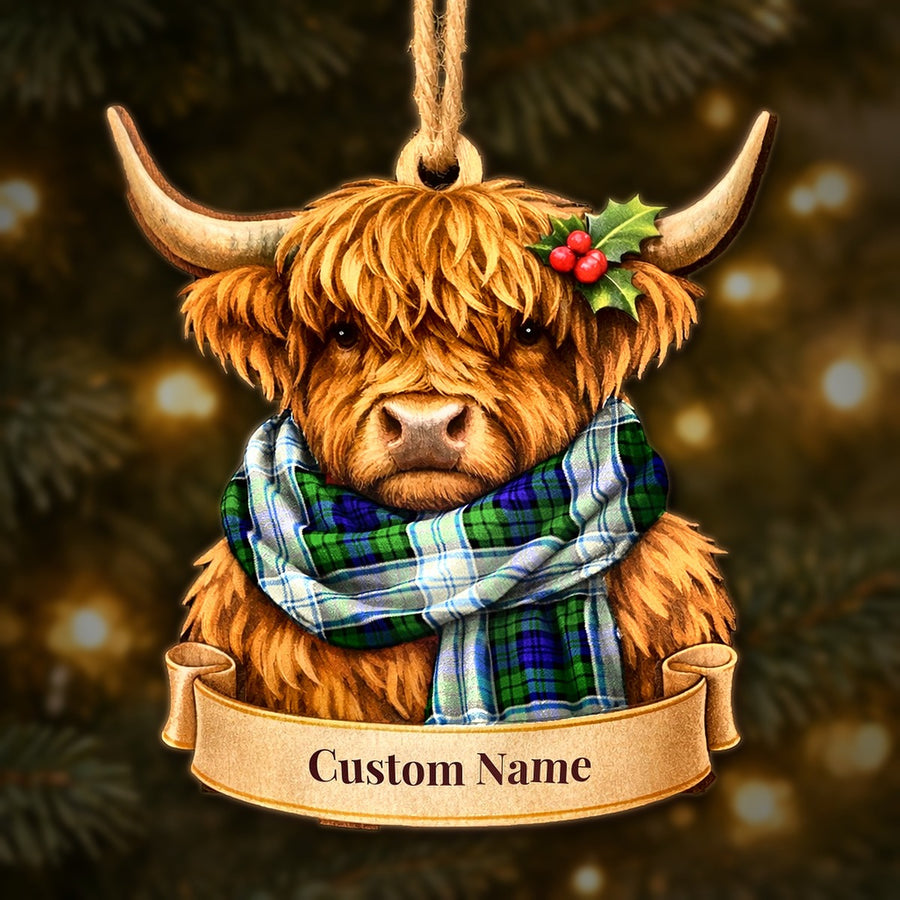 Wooden Highland cow Christmas ornament wearing a Blackwatch Dress Modern tartan scarf, with a ribbon banner for a custom name
