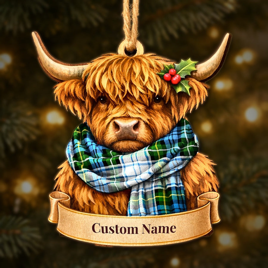 Wooden Highland cow Christmas ornament wearing a Campbell Dress tartan scarf, with a ribbon banner for a custom name