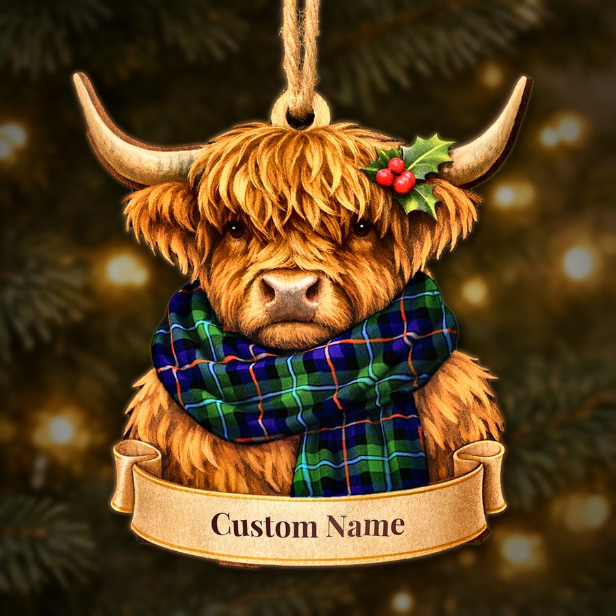 Wooden Highland cow Christmas ornament wearing a Campbell of Cawdor Modern tartan scarf, with a ribbon banner for a custom name
