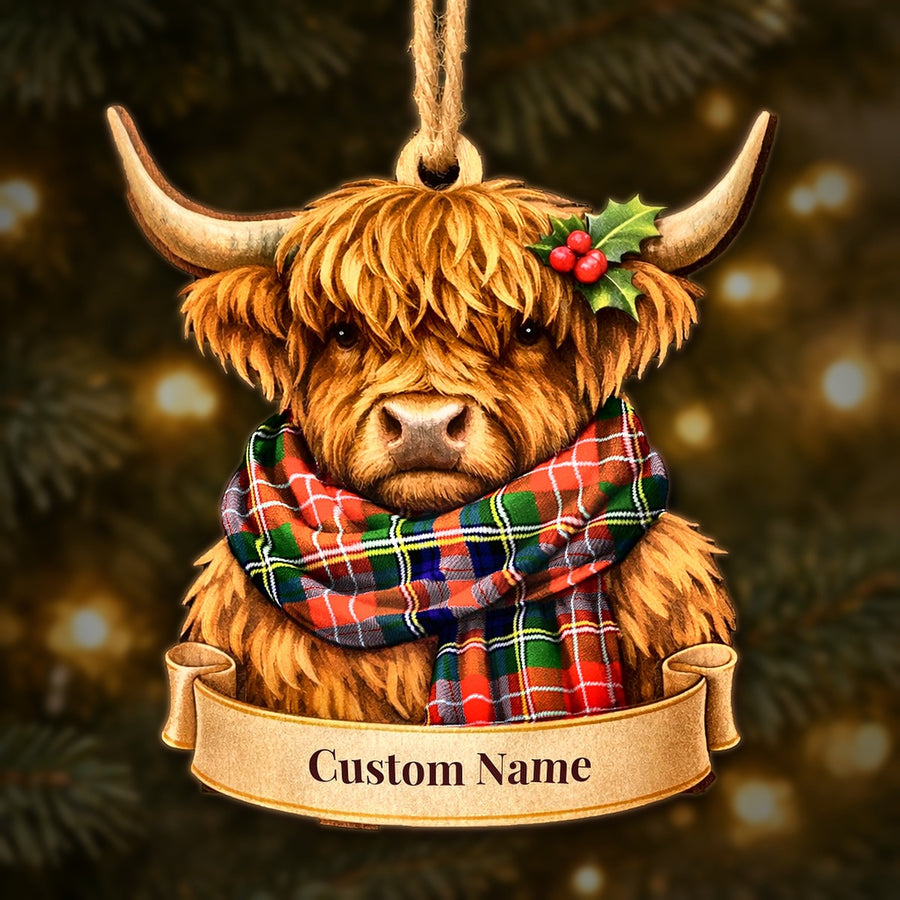 Wooden Highland cow Christmas ornament wearing a Christie tartan scarf, with a ribbon banner for a custom name
