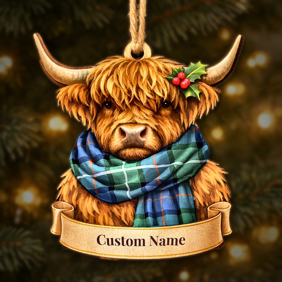 Wooden Highland cow Christmas ornament wearing a Davidson of Tulloch tartan scarf, with a ribbon banner for a custom name