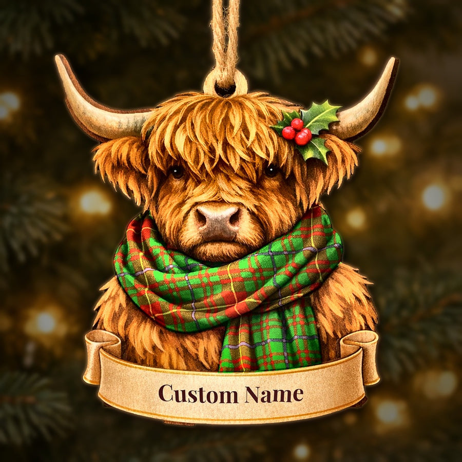 Wooden Highland cow Christmas ornament wearing a Fulton tartan scarf, with a ribbon banner for a custom name