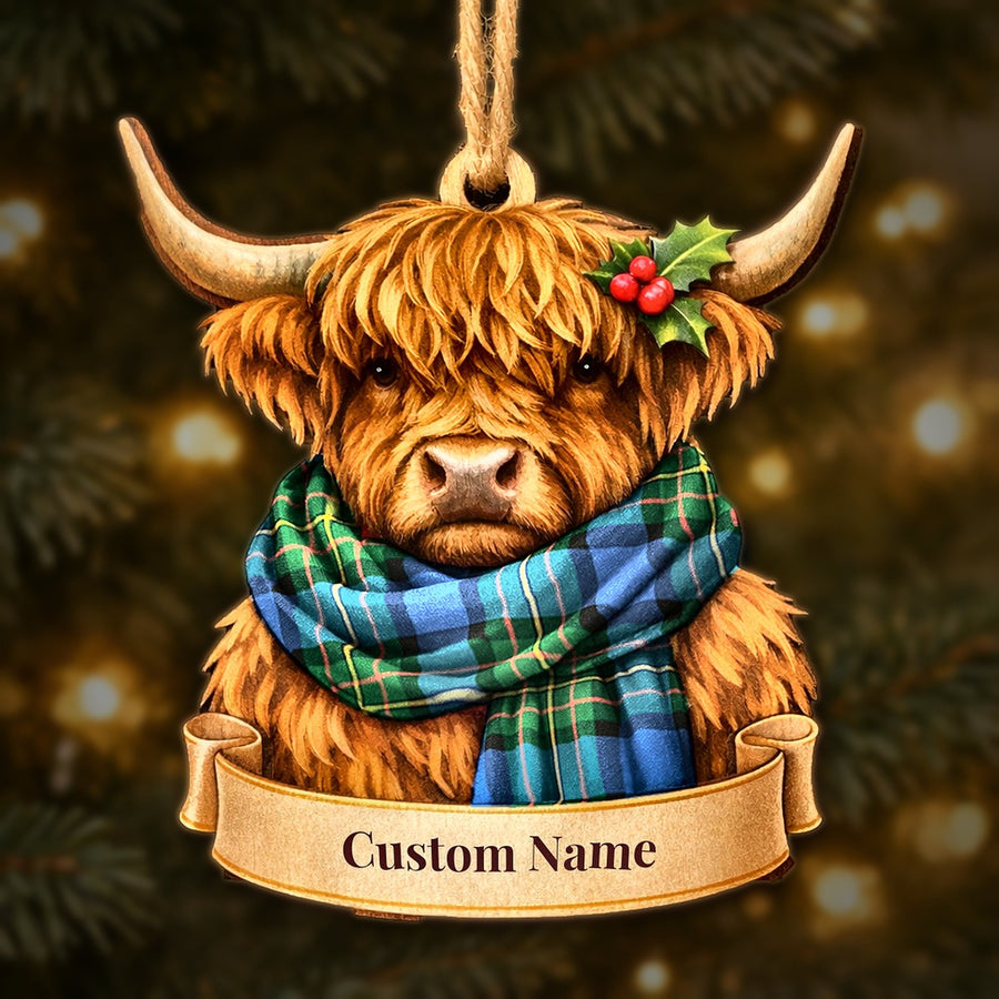 Wooden Highland cow Christmas ornament wearing a MacLaren Ancient tartan scarf, with a ribbon banner for a custom name