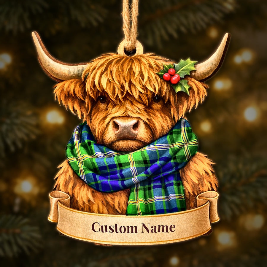 Wooden Highland cow Christmas ornament wearing a Maitland tartan scarf, with a ribbon banner for a custom name