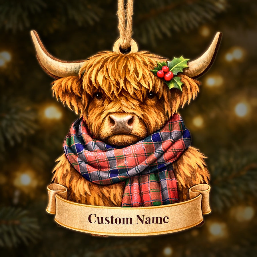 Wooden Highland cow Christmas ornament wearing a Robertson Modern tartan scarf, with a ribbon banner for a custom name