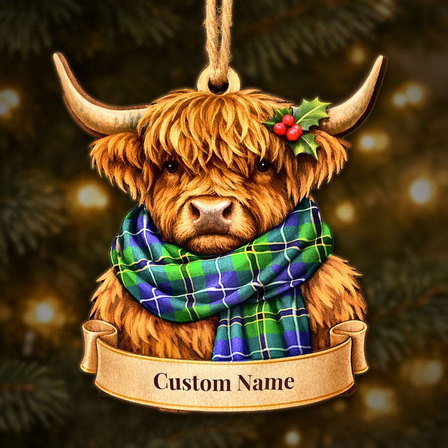 Wooden Highland cow Christmas ornament wearing a Turnbull Hunting tartan scarf, with a ribbon banner for a custom name